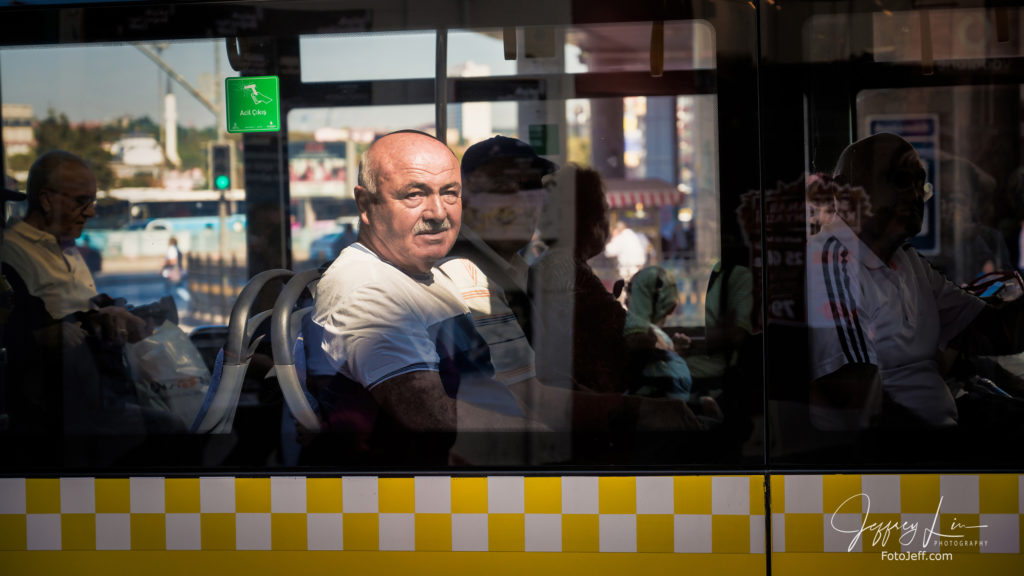 20. Looking Through Bus Window